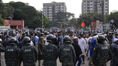 Security forces stand guard at the entrance of nation's Parliament complex as people arrive to perform funeral prayers for leading Bangladeshi activist Sharif Osman Hadi. (AP) Security forces stand guard at the entrance of nation's Parliament complex as people arrive to perform funeral prayers for leading Bangladeshi activist Sharif Osman Hadi. (AP)