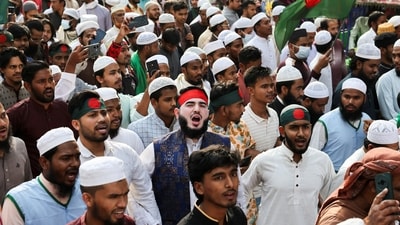 Members of the multiple organisations including Khelafat Majlis join in a protest rally after Friday prayer, demanding justice for the death of Sharif Osman Hadi. (REUTERS)