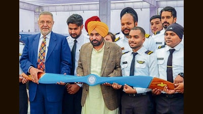 From left: Punjab health minister Balbir Singh and chief minister Bhagwant Mann with trainee pilots and aviation engineers during the ‘Ambran Di Udari’ pilot training programme at the Punjab Aircraft Maintenance and Engineering College and Patiala Aviation Club, in Patiala, Saturday. (PTI)