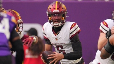 Washington Commanders quarterback Jayden Daniels (5) drops back to pass against the Minnesota Vikings (IMAGN IMAGES via Reuters Connect)