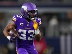 Minnesota Vikings running back Aaron Jones Sr. runs with the ball after a reception vs the Cowboys Minnesota Vikings running back Aaron Jones Sr. runs with the ball after a reception vs the Cowboys