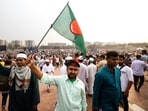 Mourners were seen with Bangladesh's national flag during the funeral of student leader Sharif Osman Hadi in Dhaka on December 20. Mourners were seen with Bangladesh's national flag during the funeral of student leader Sharif Osman Hadi in Dhaka on December 20.