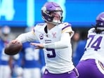 Minnesota Vikings quarterback JJ McCarthy (9) drops back to pass against the New York Giants