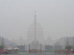 Rashtrapati Bhavan shrouded in dense winter fog on Sunday morning. (Sanjeev Verma/HT Photo)