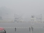 Vijay Chowk shrouded in dense winter fog on Sunday morning. (Sanjeev Verma/HT Photo)