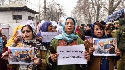 People’s Democratic Party (PDP) supporters stage a protest against the incident in which Bihar Chief Minister Nitish Kumar allegedly pulled a woman’s hijab during an event, outside the party headquarters in Srinagar on Friday. (Basit Zargar) People’s Democratic Party (PDP) supporters stage a protest against the incident in which Bihar Chief Minister Nitish Kumar allegedly pulled a woman’s hijab during an event, outside the party headquarters in Srinagar on Friday. (Basit Zargar)