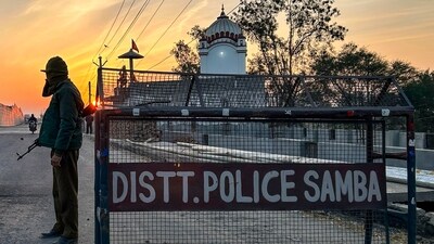 A security official stands guard in Samba. (PTI) A security official stands guard in Samba. (PTI)