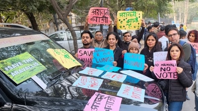 Members of 'Aravalli Bachao Sanstha' stage a demonstration as part of the Save Aravalli movement, near the residence of Haryana minister Rao Narbir Singh, in Gurugram, on Saturday. (PTI)