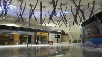 Worker at the Navi Mumbai International Airport ahead of its commercial opening on December 25 (PTI) Worker at the Navi Mumbai International Airport ahead of its commercial opening on December 25 (PTI)