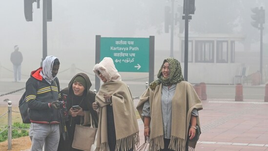 Gram it: No weather condition can deter the spirit of joyous revellers when they get to see the India Gate. Observing this bunch of smiling faces, on a cold and foggy morning at Kartavya Path, anyone can be convinced about the same and believe that Delhi winters are truly magical. (Photo: RAJ K RAJ / HT)