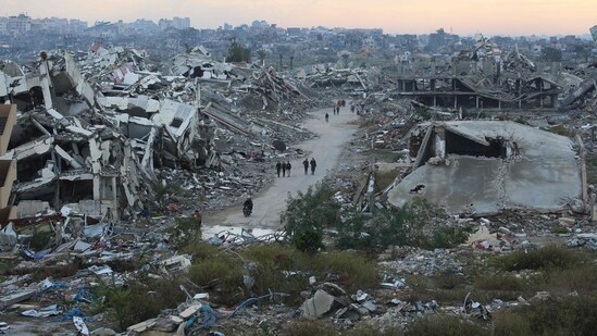 A general view of destroyed houses in Nuseirat camp in the central Gaza Strip on December 19, 2025. A famine declared in Gaza in August is now over thanks to improved access for humanitarian aid, the United Nations said on December 19, but warned the food situation in the Palestinian territory remained dire. (Photo by Eyad Baba / AFP) (AFP)
