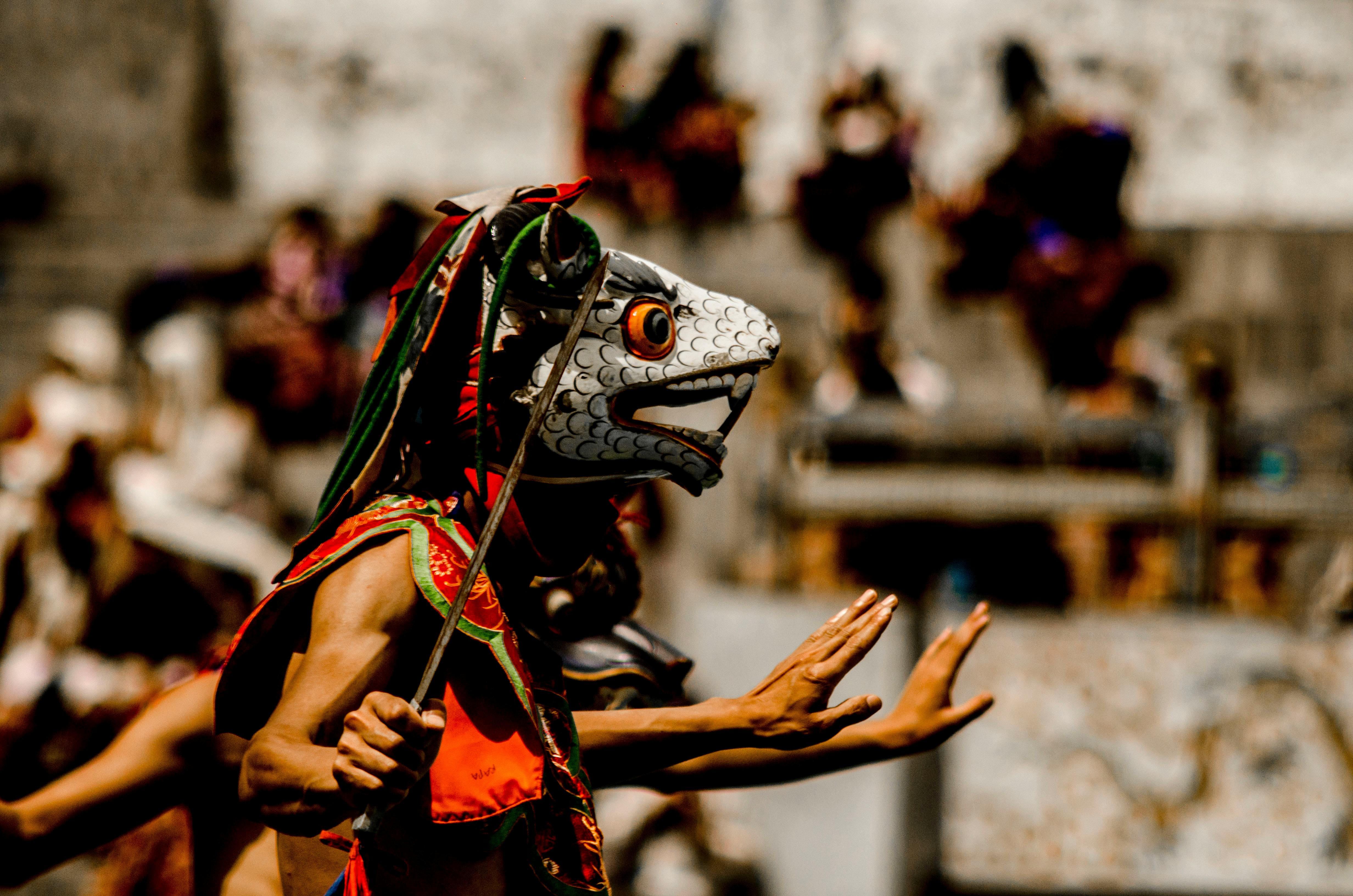 Vibrant depiction of Bhutan's traditional mask dance in a colorful festival setting in Thimphu. Vibrant depiction of Bhutan's traditional mask dance in a colorful festival setting in Thimphu.