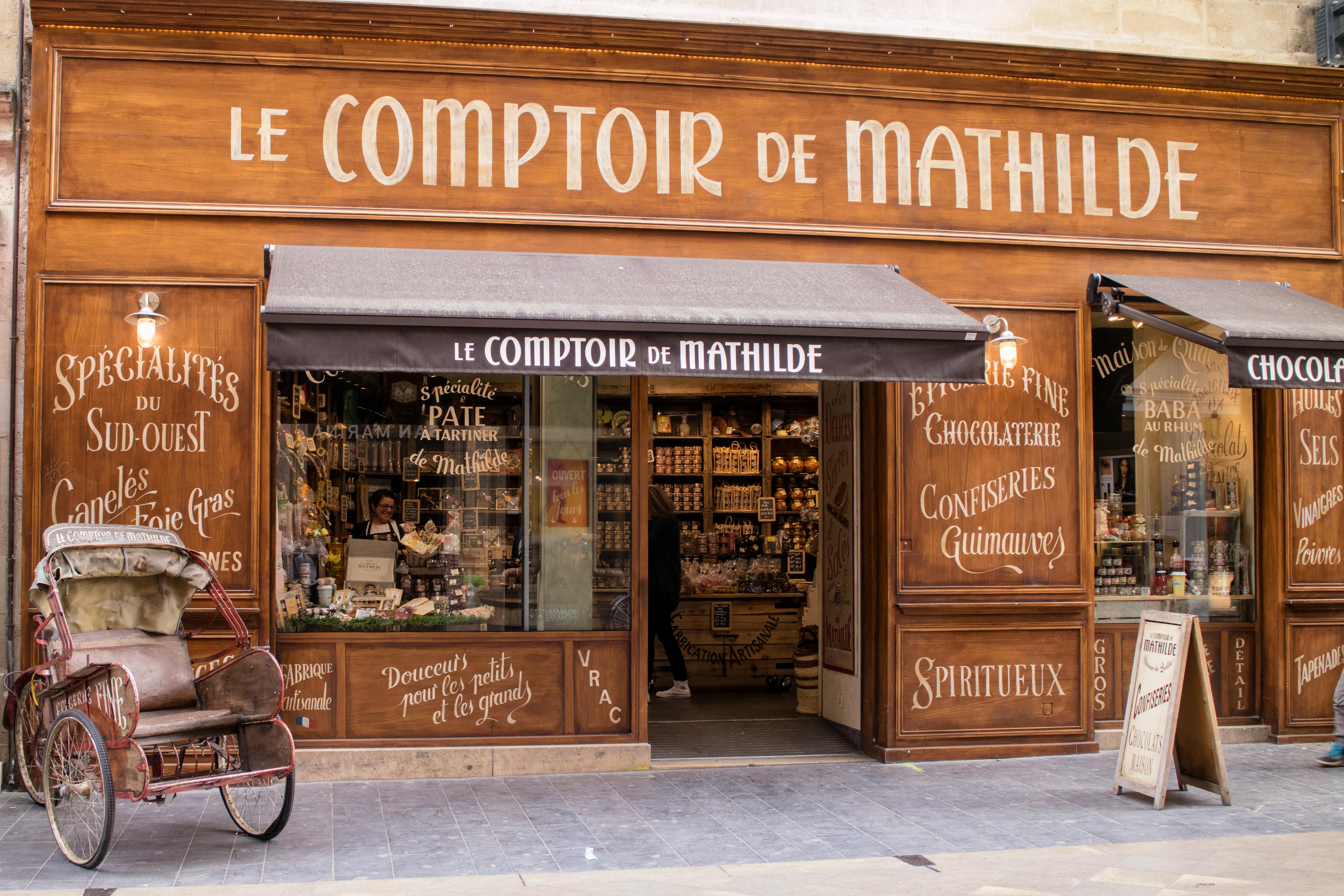 Traditional French storefront of Le Comptoir de Mathilde in Bordeaux, offering local delicacies. Traditional French storefront of Le Comptoir de Mathilde in Bordeaux, offering local delicacies.
