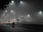 Commuters make their way through dense fog on a cold late night along Gurugram–Sohna Road near Tau Devi Lal Stadium, in Gurugram. Commuters make their way through dense fog on a cold late night along Gurugram–Sohna Road near Tau Devi Lal Stadium, in Gurugram.