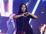 Nicki Minaj enters the stage as the surprise guest on the final day of Turning Point USA's annual AmericaFest conference at the Phoenix Convention Center on December 21. Nicki Minaj enters the stage as the surprise guest on the final day of Turning Point USA's annual AmericaFest conference at the Phoenix Convention Center on December 21.