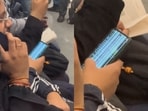 A passenger spotted in a metro using a broken phone went viral, A passenger spotted in a metro using a broken phone went viral,