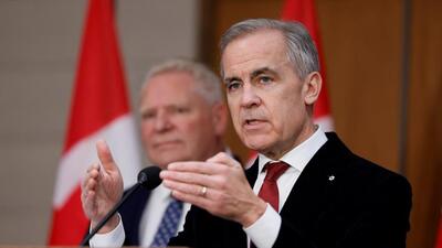 Canada's Prime Minister Mark Carney (right) and Ontario’s Premier Doug Ford take part in a press conference on Parliament Hill in Ottawa, Ontario, on December 18. (REUTERS) Canada's Prime Minister Mark Carney (right) and Ontario’s Premier Doug Ford take part in a press conference on Parliament Hill in Ottawa, Ontario, on December 18. (REUTERS)