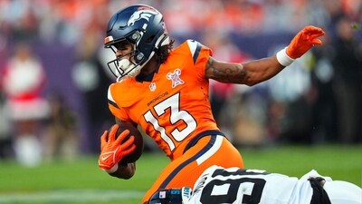 Jacksonville Jaguars defensive end Dawuane Smoot (98) tackles Denver Broncos wide receiver Pat Bryant (13) (AP)