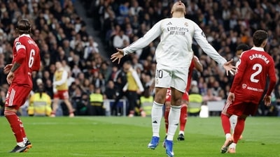 Kylian Mbappe reacts during the Spanish league football match between Real Madrid CF and Sevilla FC. (AFP) Kylian Mbappe reacts during the Spanish league football match between Real Madrid CF and Sevilla FC. (AFP)