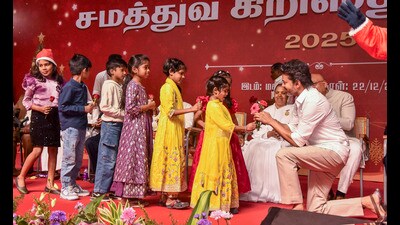 Tamilaga Vettri Kazhagam (TVK) chief Vijay receives flowers from children during an 'Equality Christmas' celebration, in Mamallapuram, Tamil Nadu on Monday. (PTI) Tamilaga Vettri Kazhagam (TVK) chief Vijay receives flowers from children during an 'Equality Christmas' celebration, in Mamallapuram, Tamil Nadu on Monday. (PTI)