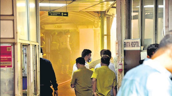 Several patients admitted to the Bhatia Hospital at Grant road were evacuated as a safety measure after a fire broke out within the hospital premises. (Bhushan Koyande/HT Photo)