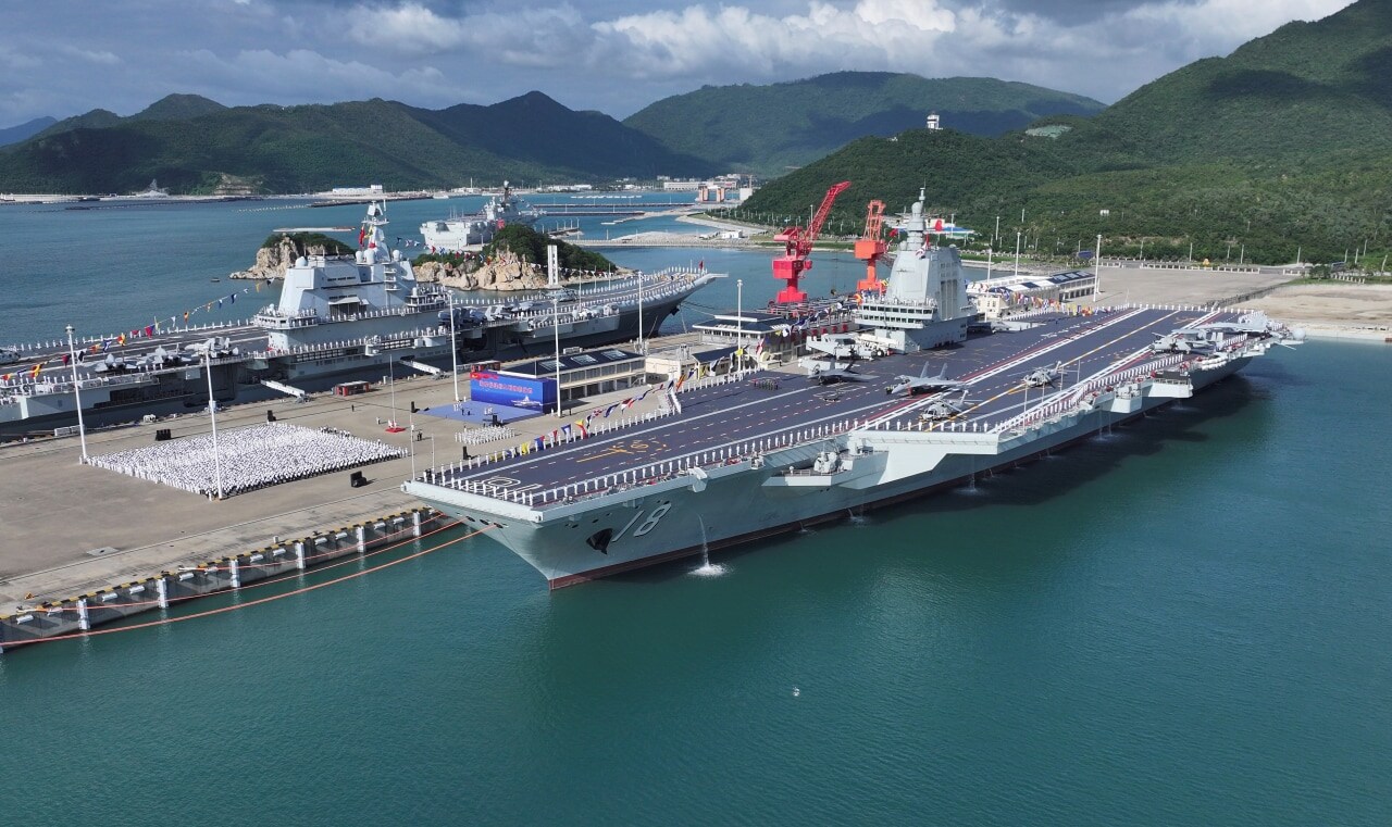 The Fujian aircraft carrier (right) was commissioned in November. The Fujian aircraft carrier (right) was commissioned in November.