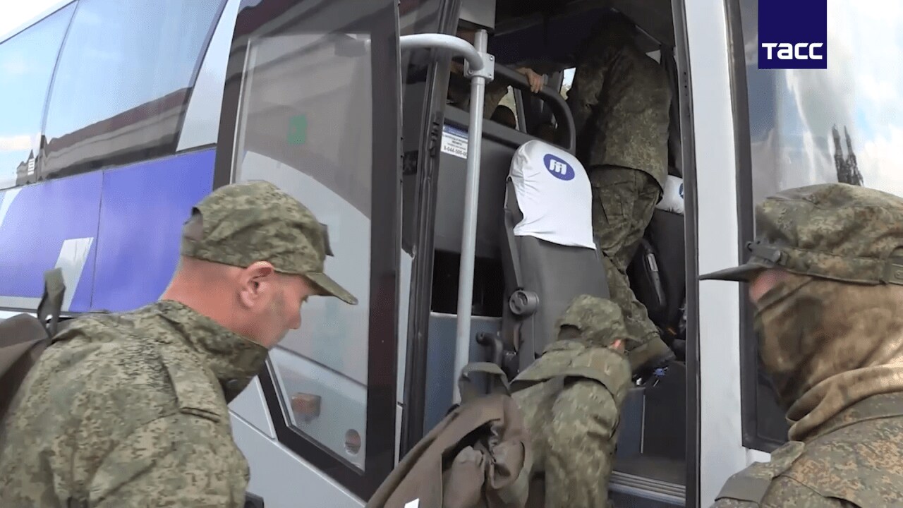 A still image from a video shows POWs boarding a bus after an exchange in May. A still image from a video shows POWs boarding a bus after an exchange in May.