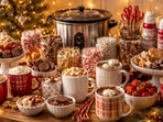 A cheerful hot chocolate station with mugs, toppings, and fairy lights makes the perfect cosy holiday corner at home.(Ai Generated)