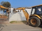 Police said the 1,000 sq yd construction had high fortified walls and barbed wire and was cleared in four hours. (HT)