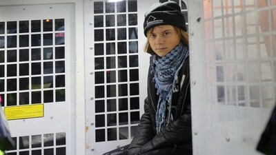Swedish activist Greta Thunberg sits inside a police van, according to solicitors acting on her behalf, as she was arrested at a pro-Palestinian protest for holding a sign that said she supported prisoners linked to Palestine Action, an organisation which the British government has proscribed as a terrorist group, in London, Britain, December 23, 2025 (via REUTERS)