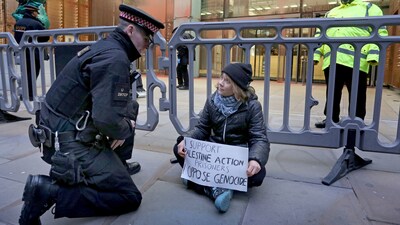In this photo, released by 'Prisoners for Palestine' on Tuesday, Dec. 23, 2025, climate activist Greta Thunberg, center, sits in front of offices of Aspen Insurance in London, England, during a protest to support the Palestine Action protesters on hunger strike in prison. (AP) In this photo, released by 'Prisoners for Palestine' on Tuesday, Dec. 23, 2025, climate activist Greta Thunberg, center, sits in front of offices of Aspen Insurance in London, England, during a protest to support the Palestine Action protesters on hunger strike in prison. (AP)