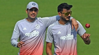 Shubman Gill (L) and teammate Axar Patel interact during a practice session (AFP) Shubman Gill (L) and teammate Axar Patel interact during a practice session (AFP)