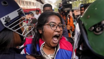West Bengal Hindu Jagran member during a protest near Bangladesh Deputy High Commission against alleged violence on minority Hindus in the neighbouring country, in Kolkata. (PTI)