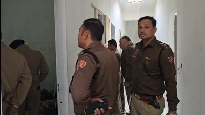 Police inspect the hotel room in Kurukshetra.