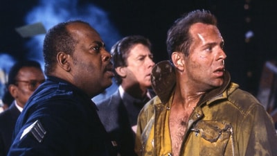 Die Hard (1988): John McClane, a New York City cop, fights to save his estranged wife and other people taken hostage by terrorists during a Christmas Eve party at the Nakatomi Plaza Skyscraper in Los Angeles, California (IMDb) Die Hard (1988): John McClane, a New York City cop, fights to save his estranged wife and other people taken hostage by terrorists during a Christmas Eve party at the Nakatomi Plaza Skyscraper in Los Angeles, California (IMDb)
