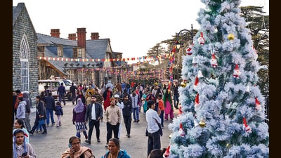 Tourists strolling on the Ridge, in Shimla, on Tuesday. (PTI)