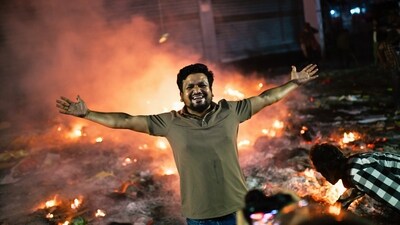 A protester reacts to the camera near the premises of the Prothom Alo daily newspaper which was set on fire by angry protesters after the death of a prominent activist Sharif Osman Hadi (AP) A protester reacts to the camera near the premises of the Prothom Alo daily newspaper which was set on fire by angry protesters after the death of a prominent activist Sharif Osman Hadi (AP)