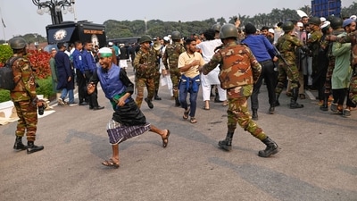 Security forces control a group of people who arrived to participate in the funeral prayers for leading Bangladeshi activist Sharif Osman Hadi. (AP) Security forces control a group of people who arrived to participate in the funeral prayers for leading Bangladeshi activist Sharif Osman Hadi. (AP)