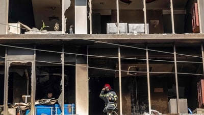 A firefighter stands inside the burnt and vandalised building of the Prothom Alo newspaper in Dhaka, amid protests and voilence (AFP) A firefighter stands inside the burnt and vandalised building of the Prothom Alo newspaper in Dhaka, amid protests and voilence (AFP)