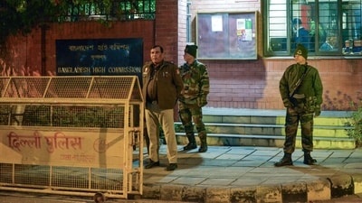 Security officials stand guard outside the Bangladesh High Commission following violent protests and unrest in Bangladesh. (ANI) Security officials stand guard outside the Bangladesh High Commission following violent protests and unrest in Bangladesh. (ANI)