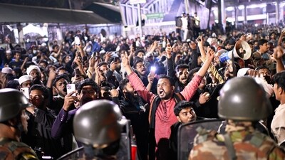 Protesters were seen shouting slogans in front of the premises of the Prothom Alo newspaper as security forces tries to control the crowd in Bangladesh (AP) Protesters were seen shouting slogans in front of the premises of the Prothom Alo newspaper as security forces tries to control the crowd in Bangladesh (AP)