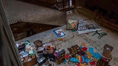 People stand inside the vandalised office of the Chhayanaut in Dhaka on, amid protests following the news of the death of youth leader Sharif Osman Hadi. (AFP) People stand inside the vandalised office of the Chhayanaut in Dhaka on, amid protests following the news of the death of youth leader Sharif Osman Hadi. (AFP)