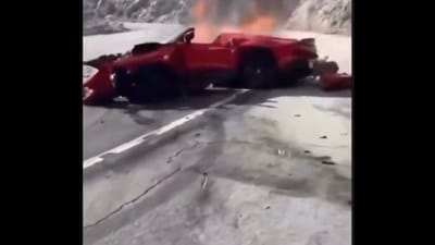 The video shows others on the road rushing to the crashed car and pulling away a person from the mangled remains of the vehicle. (Grab from X video by TheInsiderPaper) The video shows others on the road rushing to the crashed car and pulling away a person from the mangled remains of the vehicle. (Grab from X video by TheInsiderPaper)