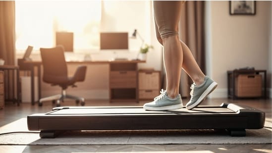 Turn everyday steps into easy home fitness with a compact walking pad. (Adobe Stock )