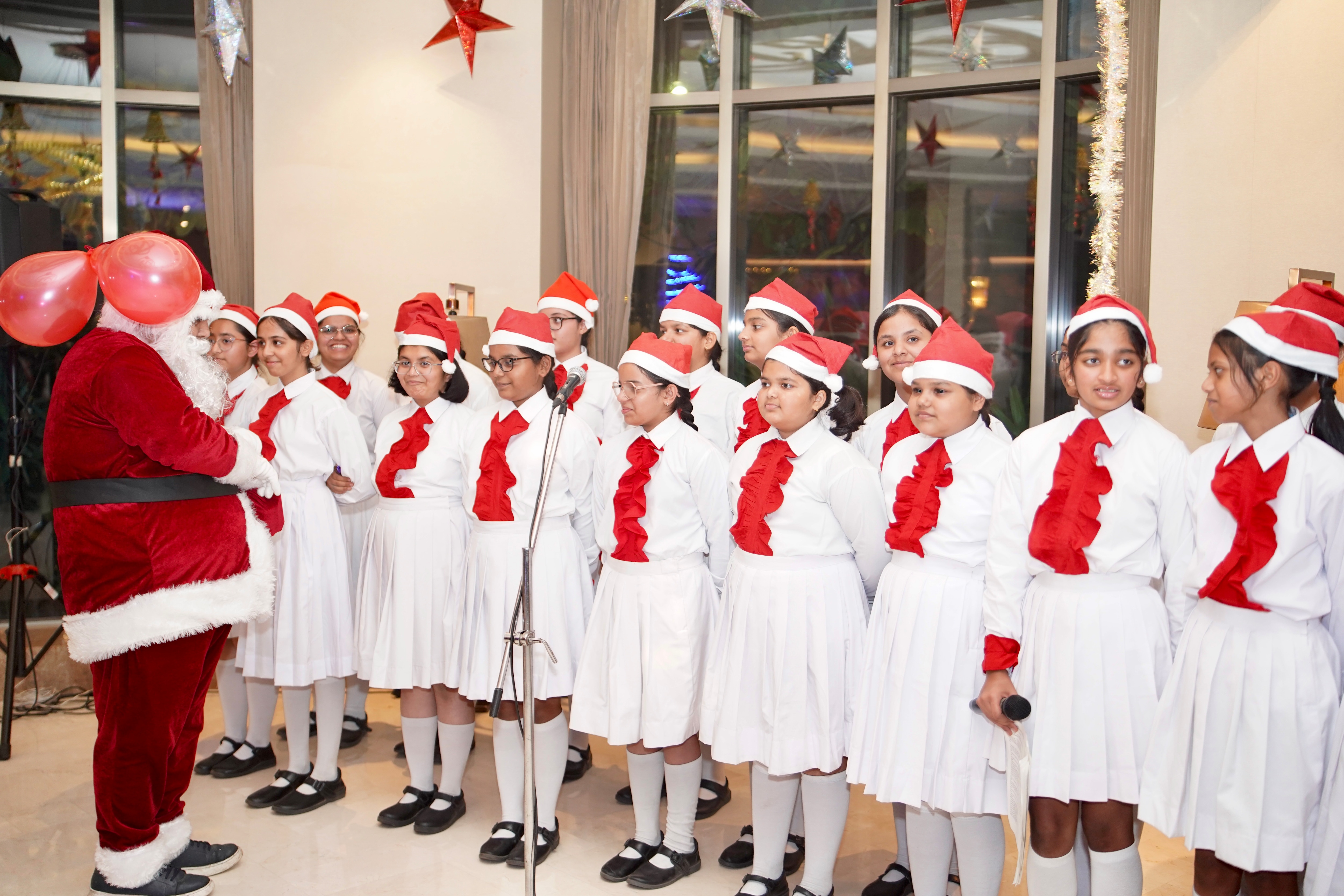 Students performing choir singing at Novotel Lucknow