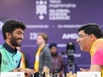 D Gukesh and Viswanathan Anand share a moment.