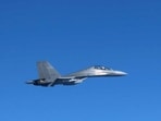 This handout photo taken on December 9, 2025 shows a Chinese J-16 fighter jet flying over the sea near Japan.
