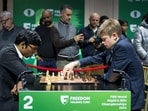 GM Volodar Murzin (R) during a match with R Praggnanandhaa at FIDE World Rapid Chess Championship 2024.(PTI)