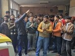 People protest after a video of a doctor allegedly assaulting a patient, who was lying on a hospital bed, at Indira Gandhi Medical College (IGMC), went viral, outside the hospital in Shimla, on Monday. (HT Photo)