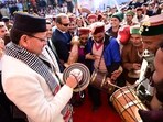 Dhami joins local artists in a traditional welcome during the inauguration of the Kedarkantha Winter Festival in Sankri.
